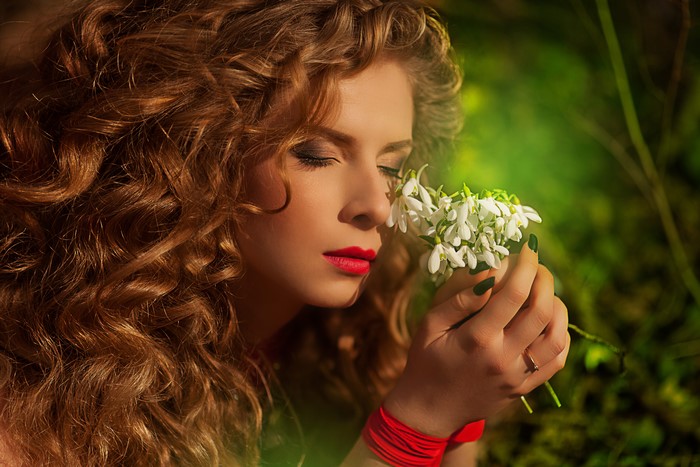 Redhead girl with snowdrops