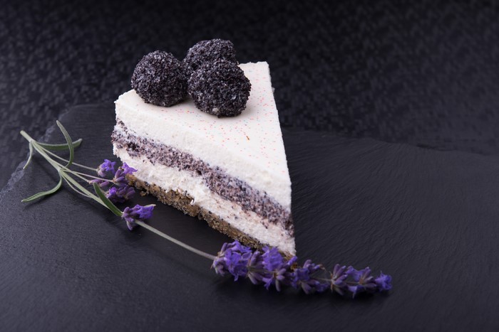 Slice of poppy seed cake with lavender