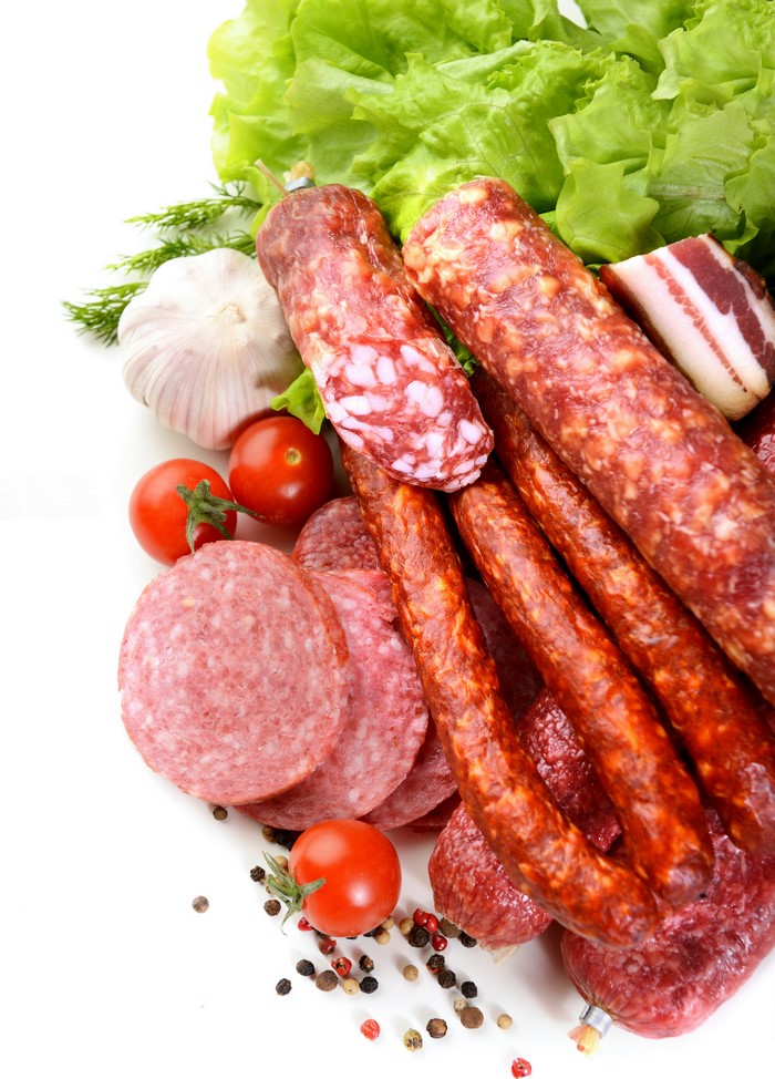 Assortment of Sausages, Garlic, Tomatoes, and Lettuce