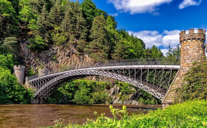 Stone bridge with towers over a river