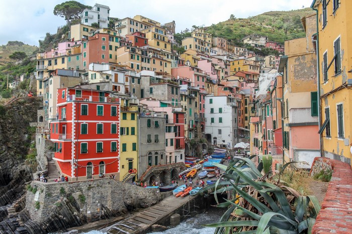 Colorful houses on a cliffside in Riomaggiore, Italy