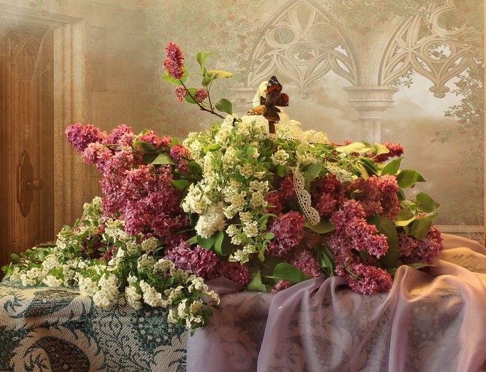 Bouquet of lilacs and white flowers with a butterfly