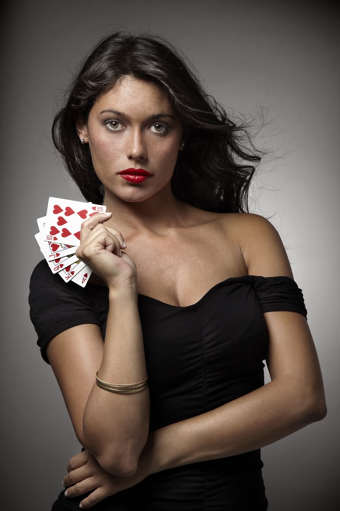 Woman holding playing cards