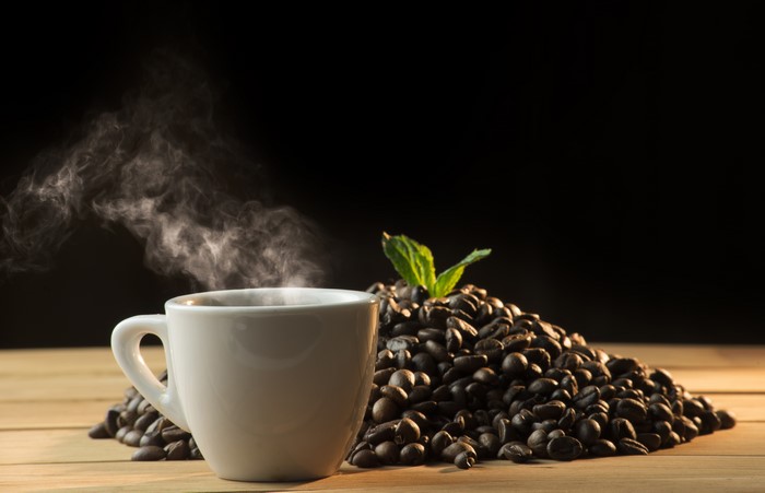 Hot Coffee Cup with Coffee Beans and Steam