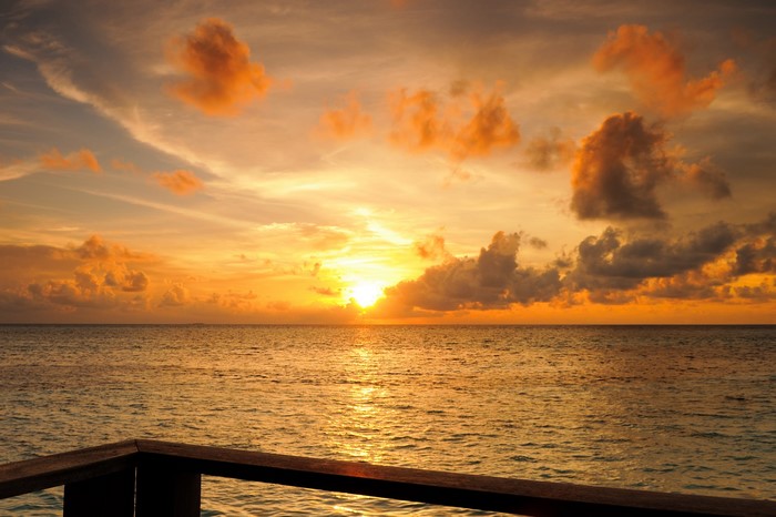 Sunset over the ocean with clouds