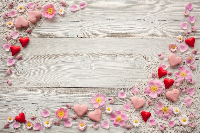 Valentine's Day hearts and flowers on wood planks