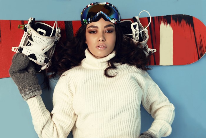 Woman with Snowboard and Goggles