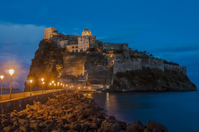 Castello Aragonese on a rocky island at dusk