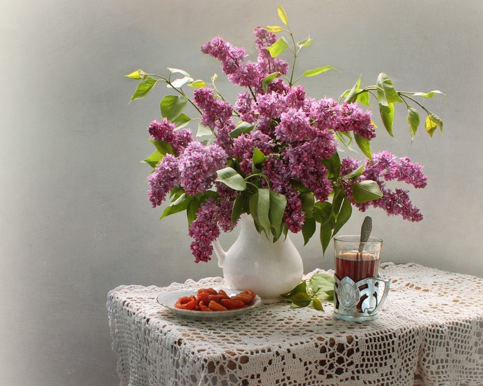 Still-life with lilac, tea, and dried apricots