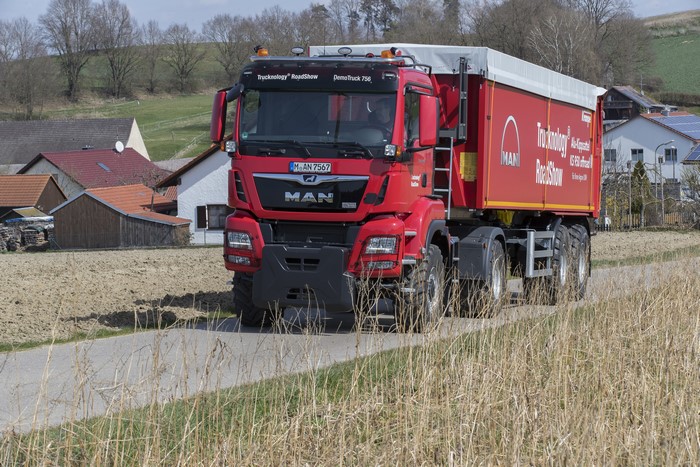 Red MAN Truck with Trailer on Road