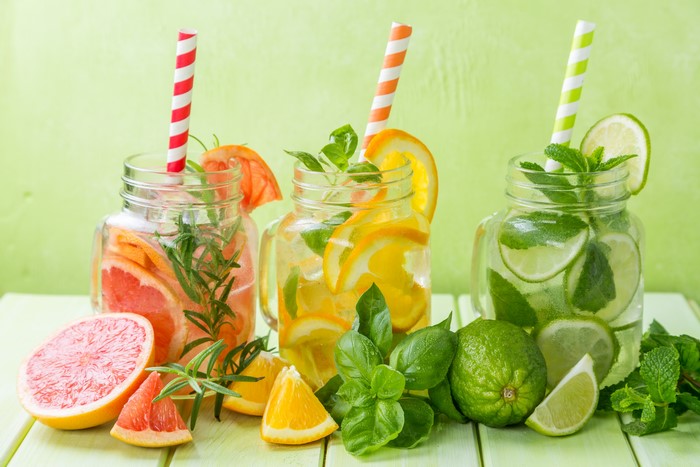 Grapefruit, Orange, and Lime infused water in mason jars