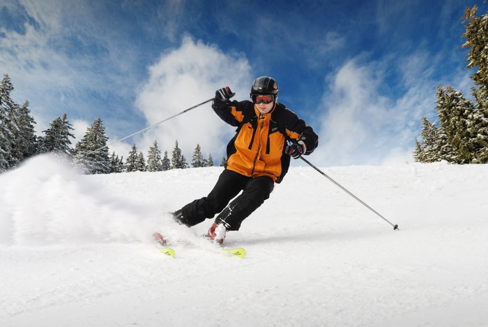 Man skiing down a snowy slope