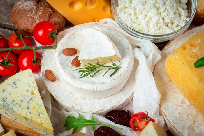 Assortment of Cheeses, Tomatoes, Nuts, and Bread