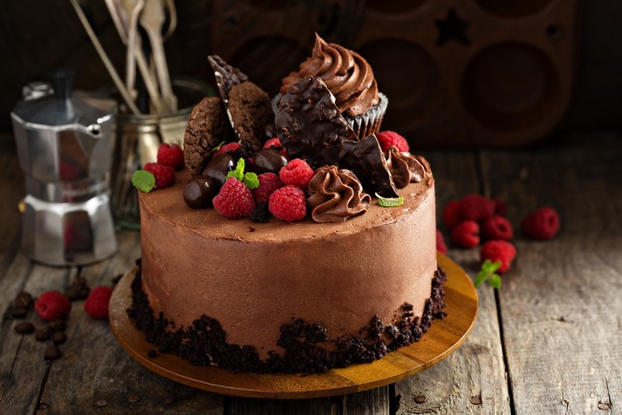 Chocolate cake with raspberries and chocolate decorations