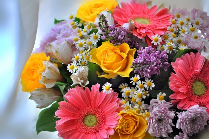 Bouquet of Gerbera daisies, roses, and lilacs