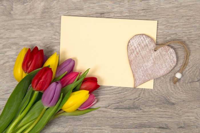 Tulips and Heart on a Wooden Background