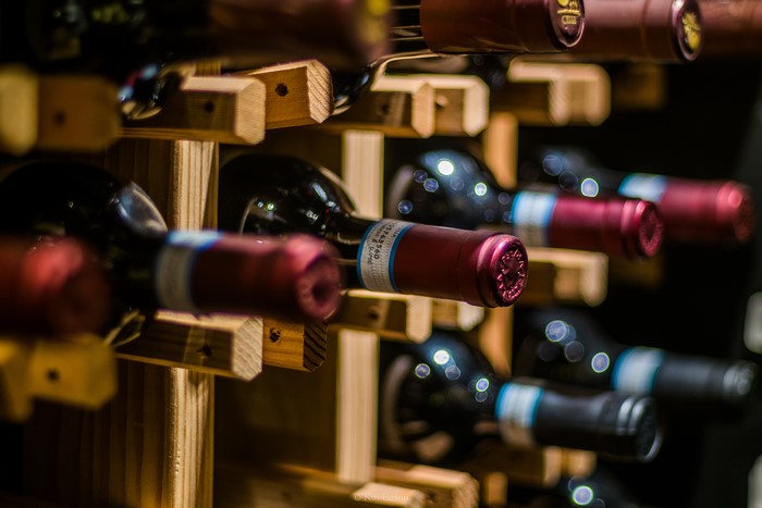 Wine bottles on a wooden rack