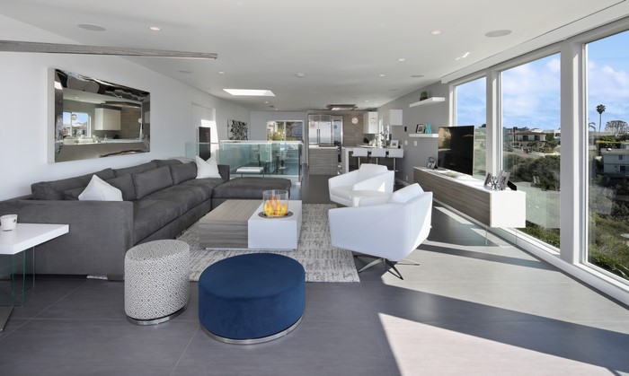 Modern living room with sectional sofa and armchairs
