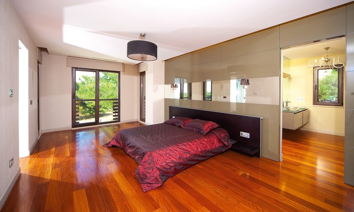 Modern Bedroom with Red Bed and Ensuite Bathroom