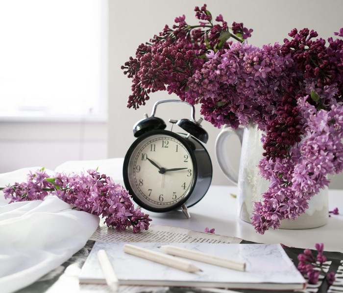 Alarm clock with lilac flowers