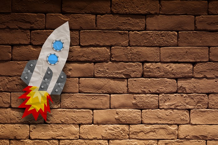 Rocket on a brick wall