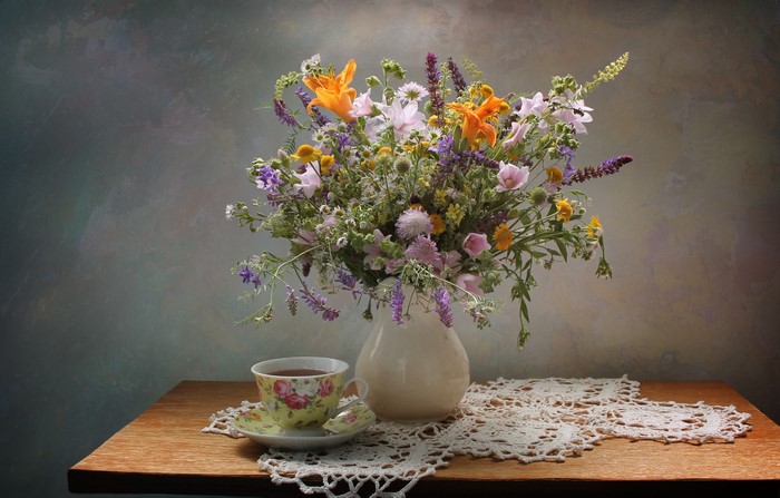 Still-life with wildflowers, tea cup, and vase
