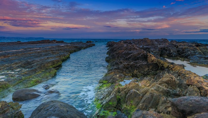 Rocky coastline at sunset in Gold Coast, Queensland, Australia