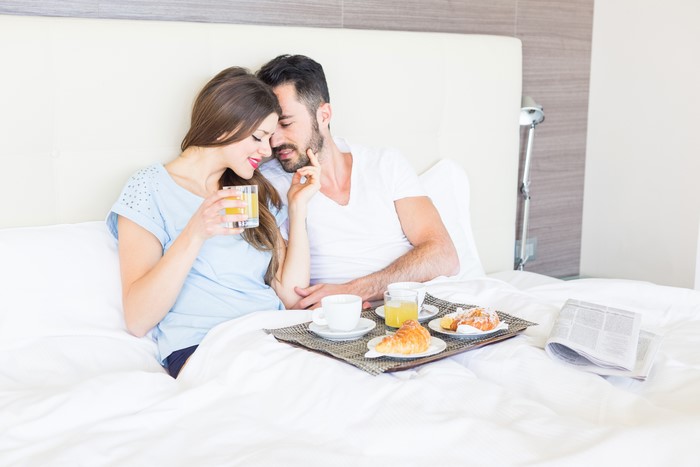 Couple Enjoying Breakfast in Bed