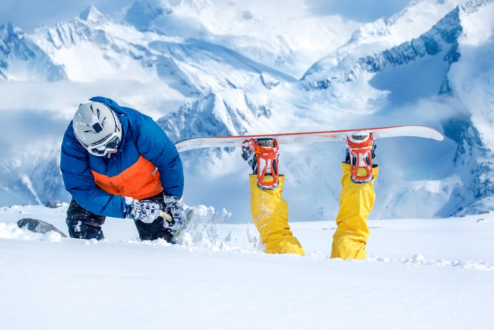 Snowboarder in snowy mountains