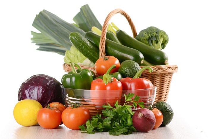 Assortment of fresh vegetables in a wicker basket