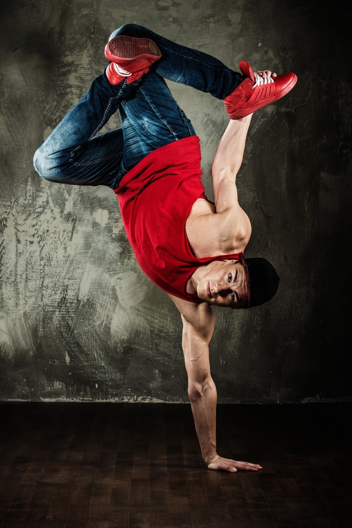Man breakdancing on one hand