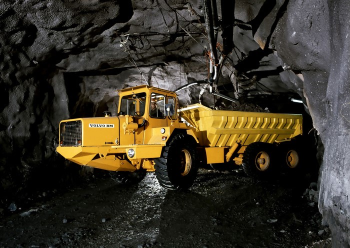 Yellow Volvo BM 860S truck in a cave