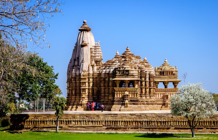 Khajuraho Chitragupta Temple in India with flowering trees