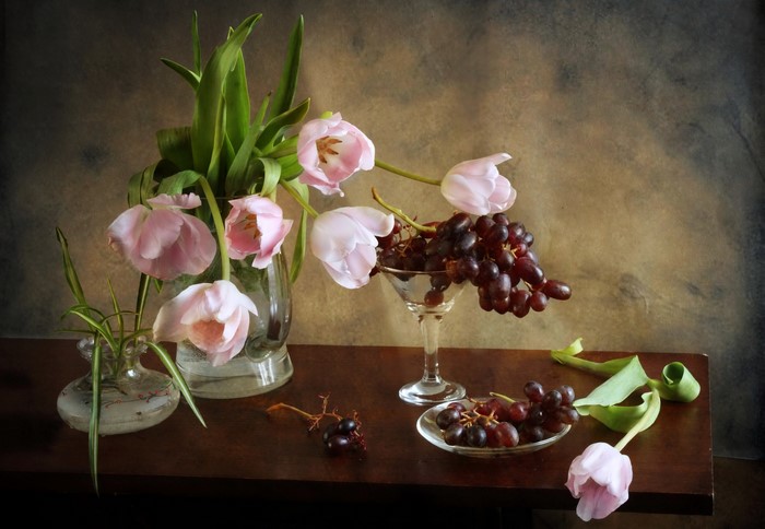 Still-life with pink tulips and grapes