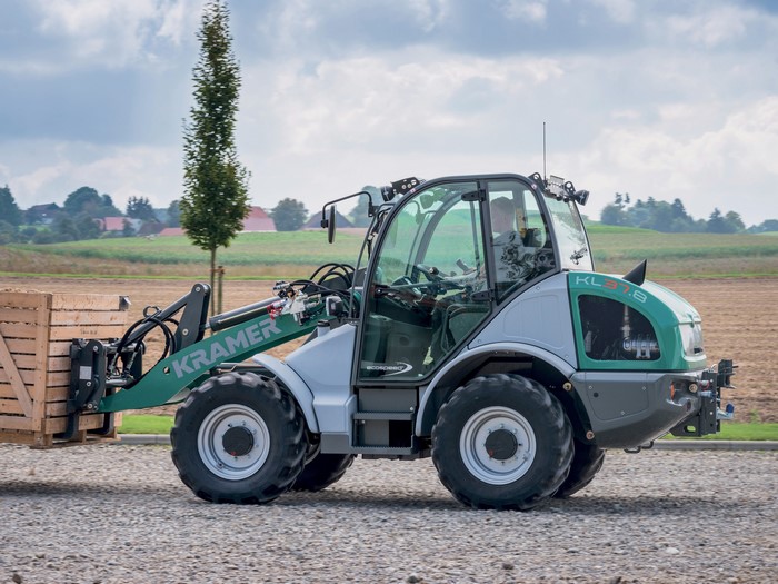 Kramer KL37.8 articulated wheel loader carrying a wooden crate
