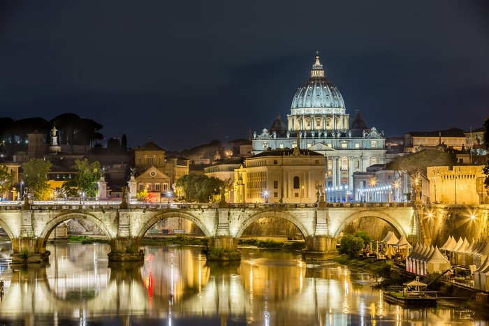 Rome at night with St. Peter's Basilica and Tiber River