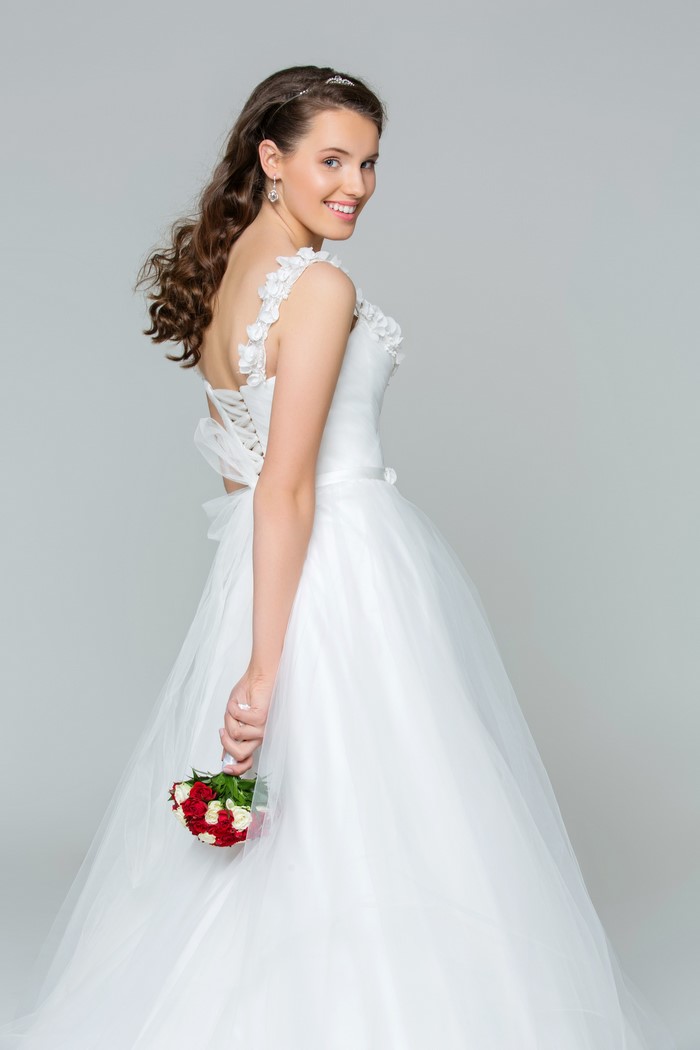 Bride in white dress holding a bouquet