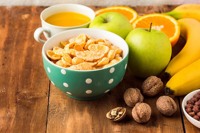 Breakfast with Corn Flakes, Fruit, Nuts, and Juice