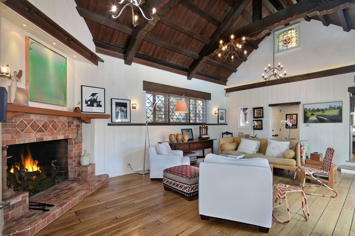 Living room with fireplace and chandelier