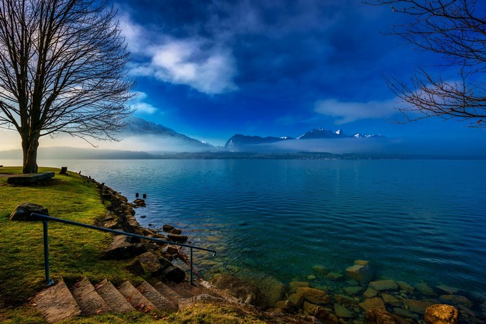 Lake Thun with Mountains and Trees in Switzerland