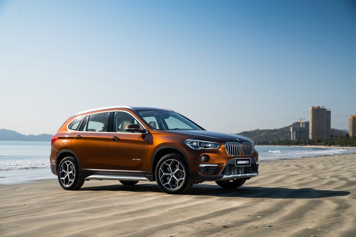 Brown BMW X1 Crossover on a Beach