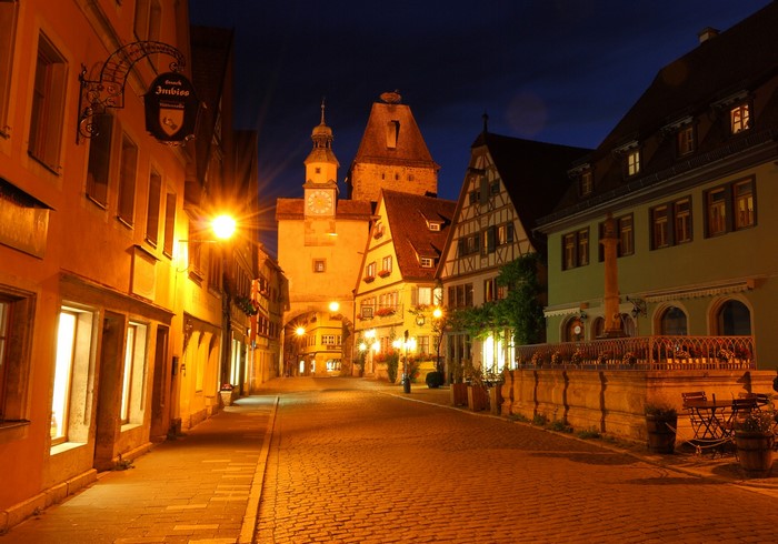 Rothenburg Germany street at night with clock tower