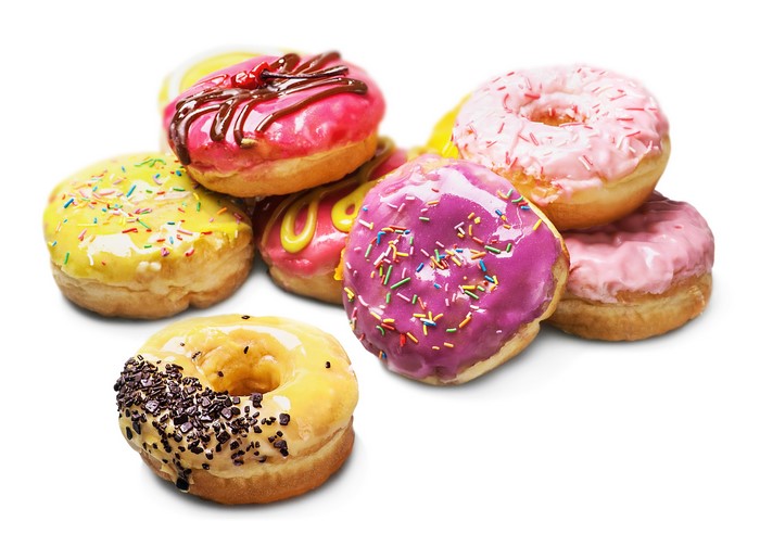 Assortment of colorful donuts on a white background