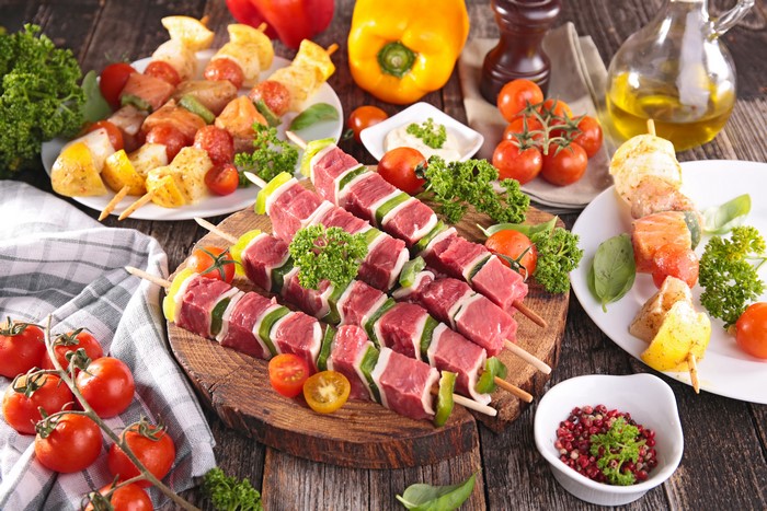 Raw Meat and Fish Kebabs with Vegetables