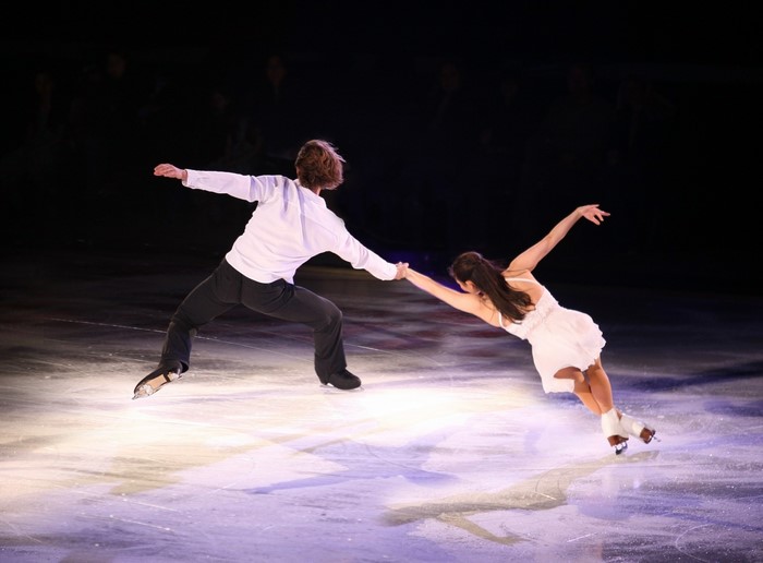 Couple ice skating on a performance