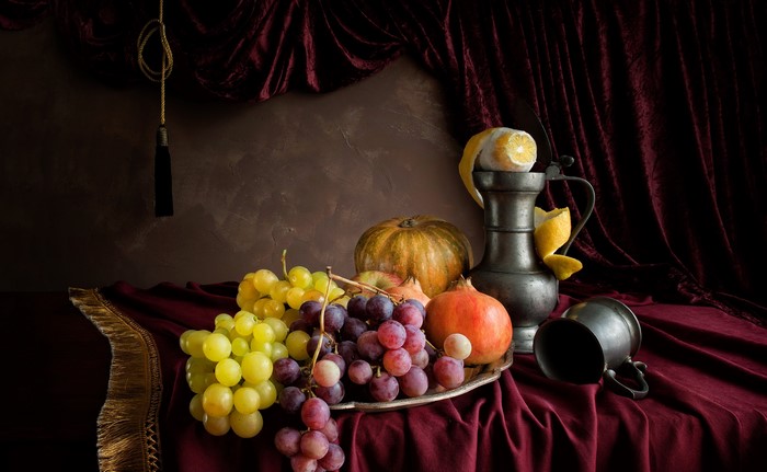Still-life with grapes, pomegranate, pumpkin, lemon, and pewter.