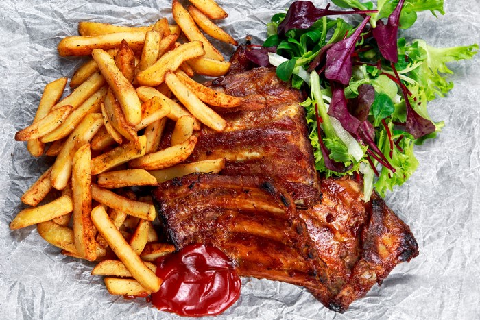 Barbecue ribs with french fries and salad