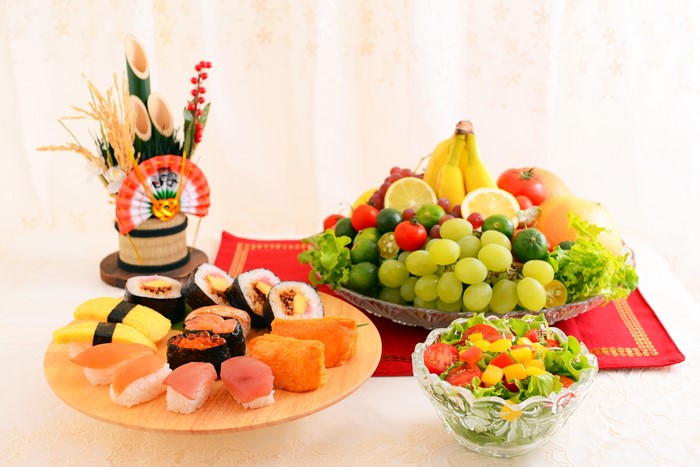 Sushi, Fruit Platter, and Salad