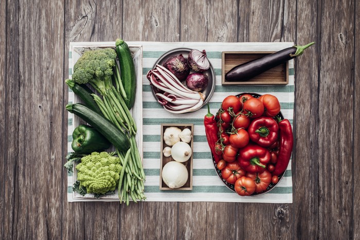 Assortment of fresh vegetables on a wooden table