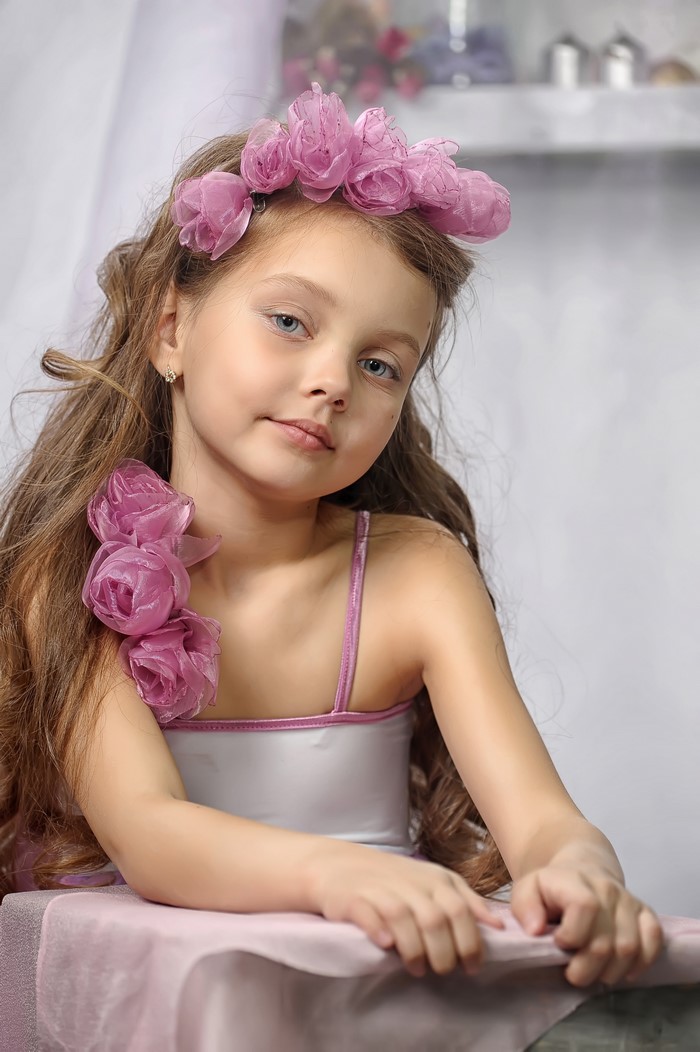 Girl with pink roses headband and dress